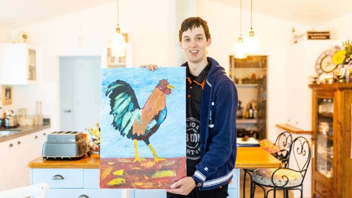 Zak Wilkojc, with one of his pieces of art.   